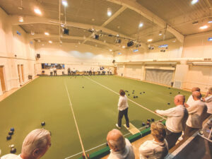 Players in action during an indoor bowls session at the community centre